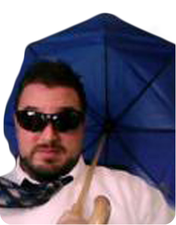 Brian in sunglasses with an umbrella in a strong wind