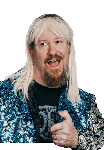 Greg in a long blond wig and a bedazzled jacket